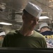 31st MEU’s Sgt. Maj., CO, and Chaplains serve dinner to Marines and Sailors