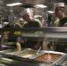 31st MEU’s Sgt. Maj., CO, and Chaplains serve dinner to Marines and Sailors