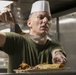 31st MEU’s Sgt. Maj., CO, and Chaplains serve dinner to Marines and Sailors
