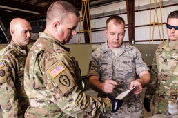 Army and Air Guardsmen work together on hurricane supply logistics
