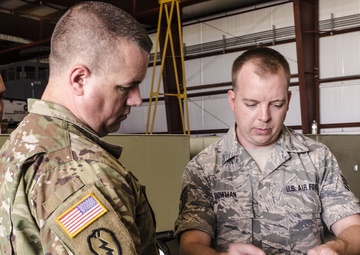 Army and Air Guardsmen work together on hurricane supply logistics