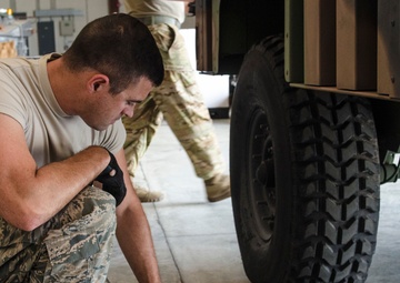 Army and Air Guardsmen work together on hurricane supply logistics