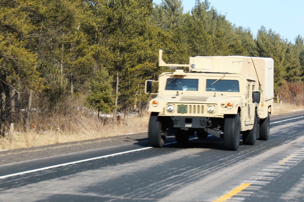 Convoy of vehicles heading for training at Fort McCoy