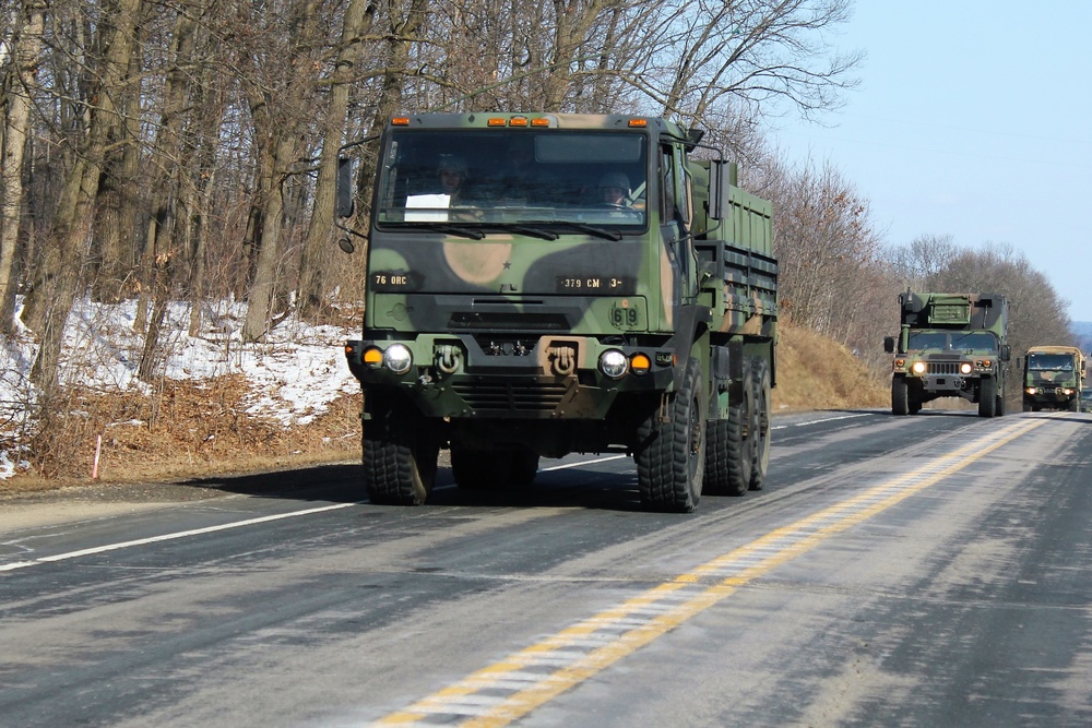 Convoy of vehicles heading for training at Fort McCoy