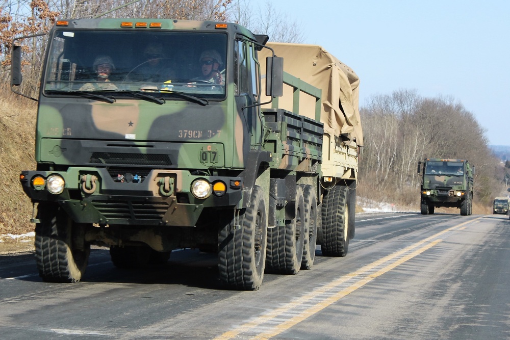 Convoy of vehicles heading for training at Fort McCoy