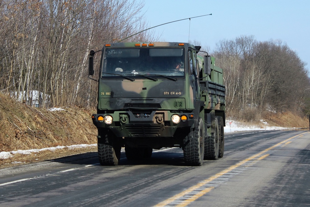 Convoy of vehicles heading for training at Fort McCoy