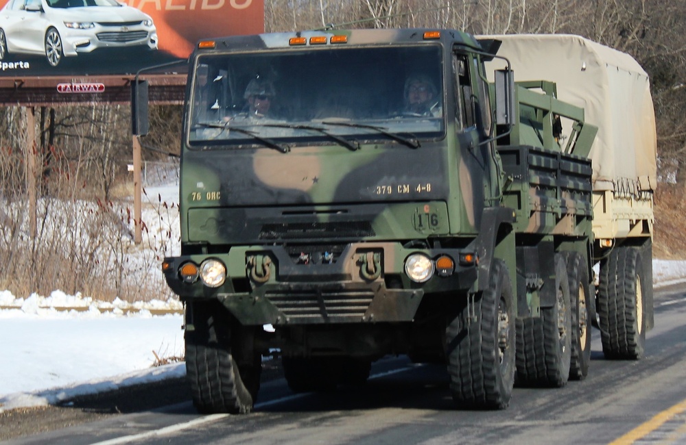 Convoy of vehicles heading for training at Fort McCoy