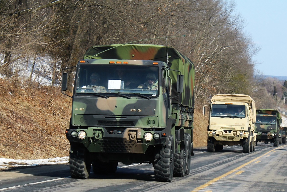 Convoy of vehicles heading for training at Fort McCoy