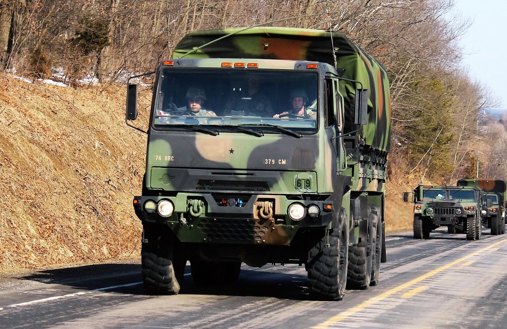 Convoy of vehicles heading for training at Fort McCoy