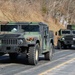 Convoy of vehicles heading for training at Fort McCoy