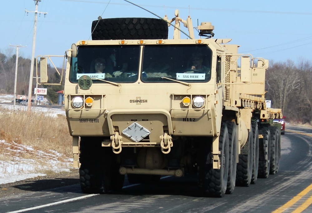 Convoy of vehicles heading for training at Fort McCoy