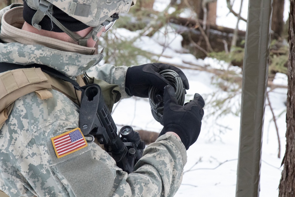 Soldier Prepares a Length of Blasting Cord