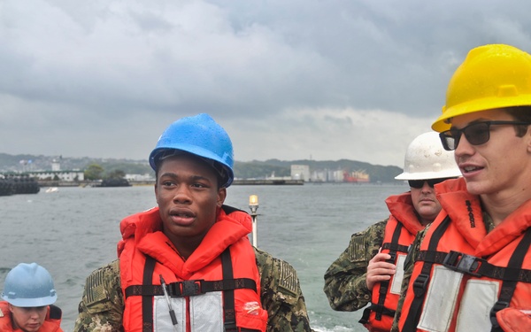 USS Emory S. Land Sailors operate rigid-hull inflatable boat during a training evolution
