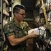 Hospital Corpsman 3rd Class John Nagy retrieves medical supplies from a storeroom during a training evolution in medical department aboard the submarine tender USS Emory S. Land (AS 39)