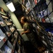 Hospital Corpsman 3rd Class Bryanna Perry searches for supplies in a storeroom during a training evolution in medical department aboard the submarine tender USS Emory S. Land (AS 39)