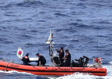 Coast Guard Cutter Steadfast launches the mini-boat Pacific Lotus