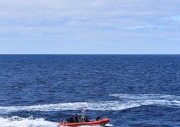 Coast Guard Cutter Steadfast launches the mini-boat Pacific Lotus