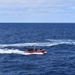 Coast Guard Cutter Steadfast launches the mini-boat Pacific Lotus