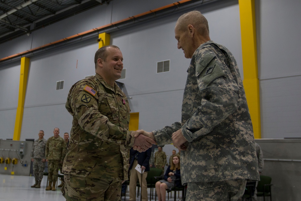Outgoing Commander Shakes Hands with General