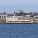 Coast Guard MH-60 helicopter crew transports navigational aid in Seal Beach