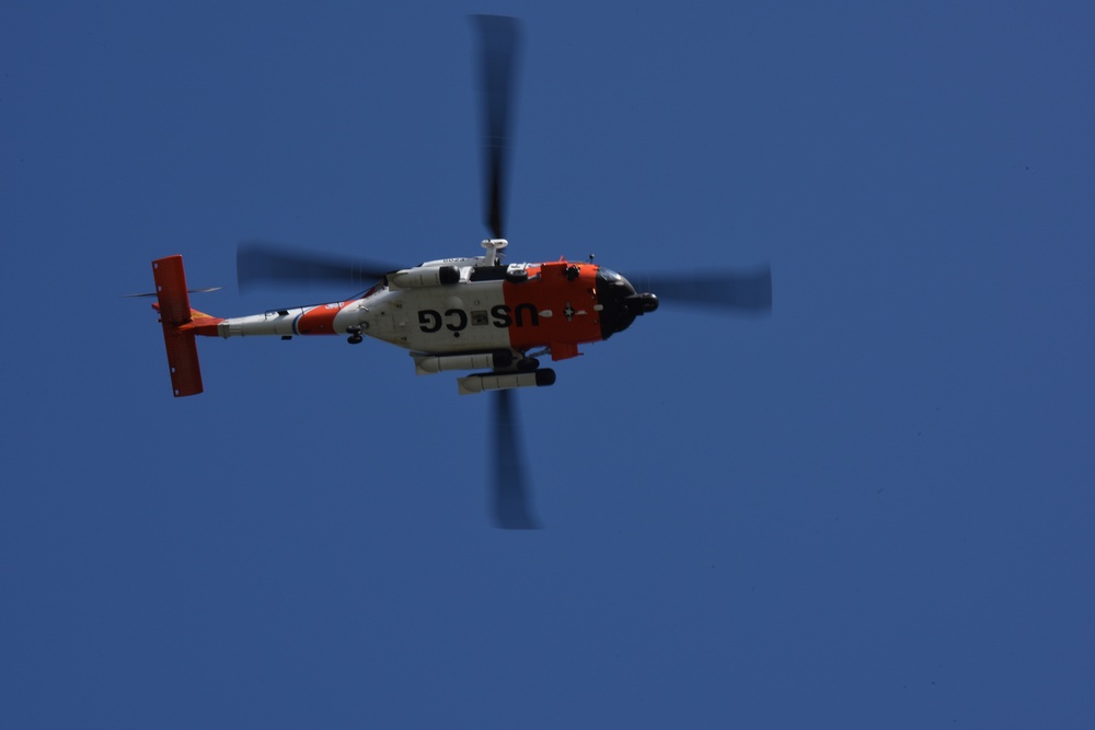 Coast Guard MH-60 Jayhawk helicopter crew transports navigational aid in Seal Beach