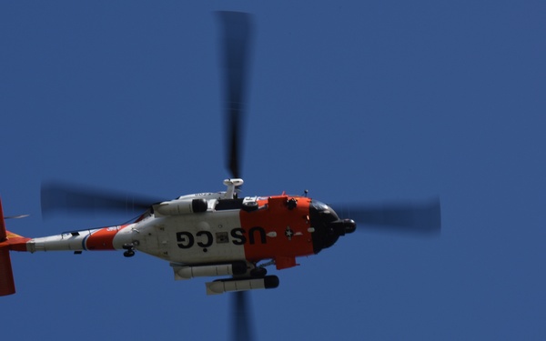 Coast Guard MH-60 Jayhawk helicopter crew transports navigational aid in Seal Beach