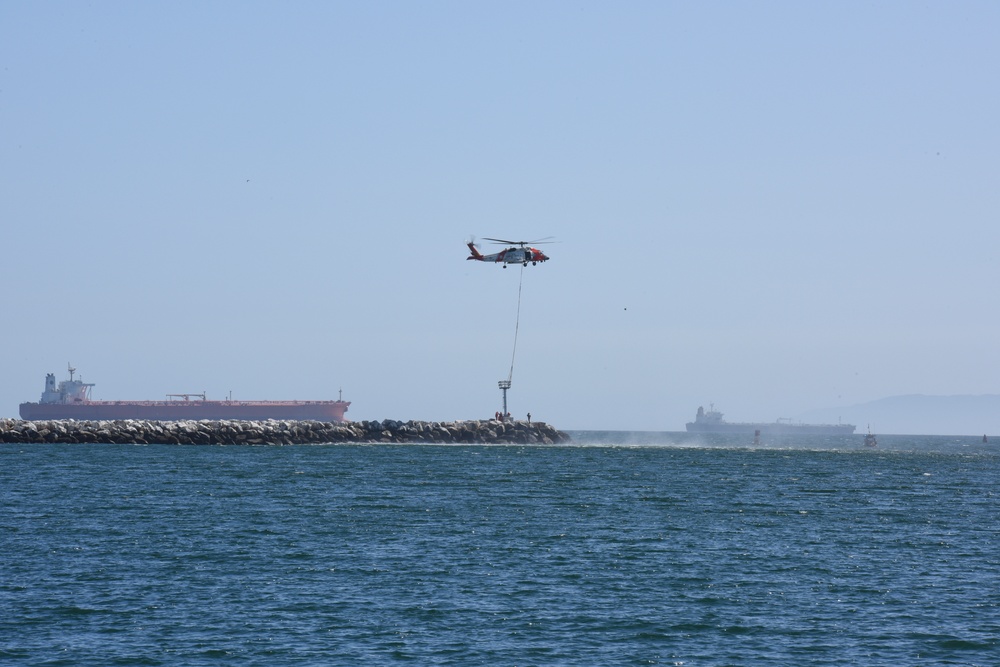 Coast Guard MH-60 Jayhawk crew transports navigational aids to Seal Beach