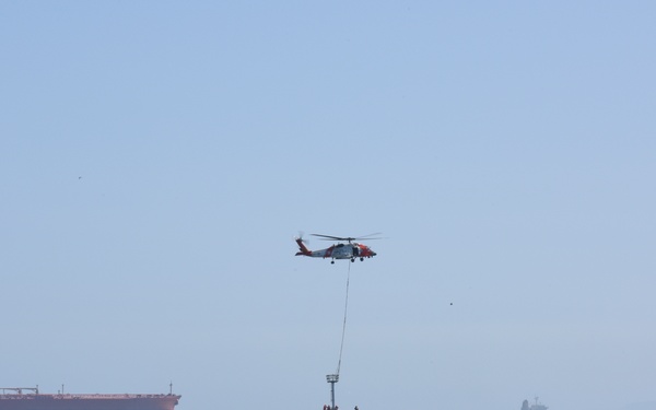 Coast Guard MH-60 Jayhawk crew transports navigational aids to Seal Beach