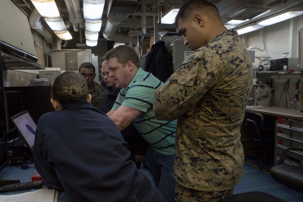 Marines and Sailors learn more about 3-D printing aboard the USS Wasp