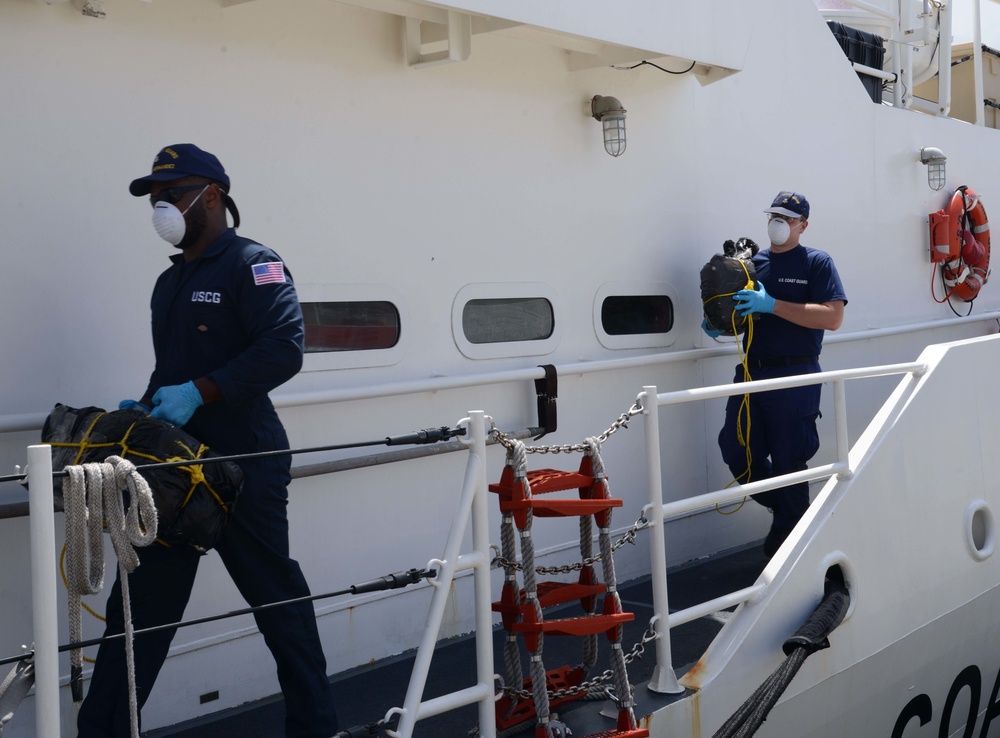 Coast Guard offloads $13.3 million in cocaine, heroin, transfers custody of 2 smugglers, following interdiction in Caribbean Sea