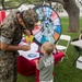 Service members and base personnel promote environmental awareness