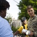 Helping hand: Marines and Sailors partake in a volunteer project