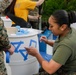 Helping hand: Marines and Sailors partake in a volunteer project