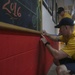 Helping hand: Marines and Sailors partake in a volunteer project