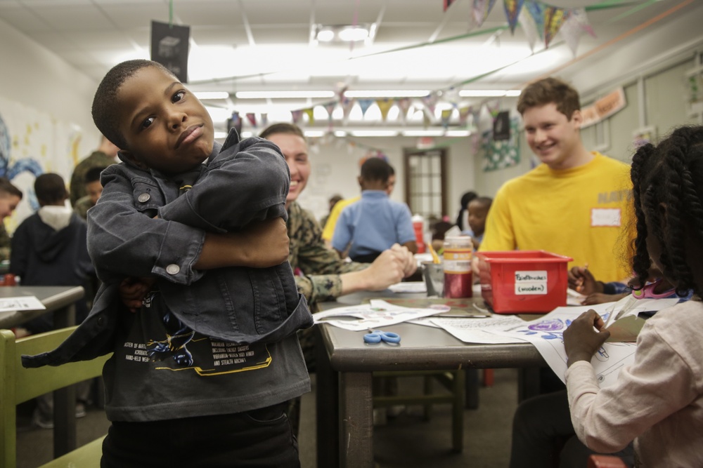 Helping hand: Marines and Sailors partake in a volunteer project