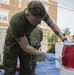 Helping hand: Marines and Sailors partake in a volunteer project