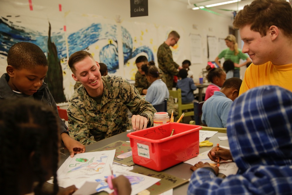 Helping hand: Marines and Sailors partake in a volunteer project