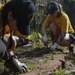 Helping hand: Marines and Sailors partake in a volunteer project