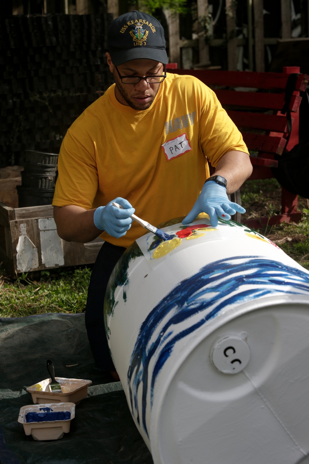 Helping hand: Marines and Sailors partake in a volunteer project