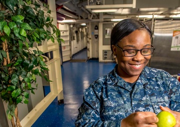 GHWB Sailor stocks apples.