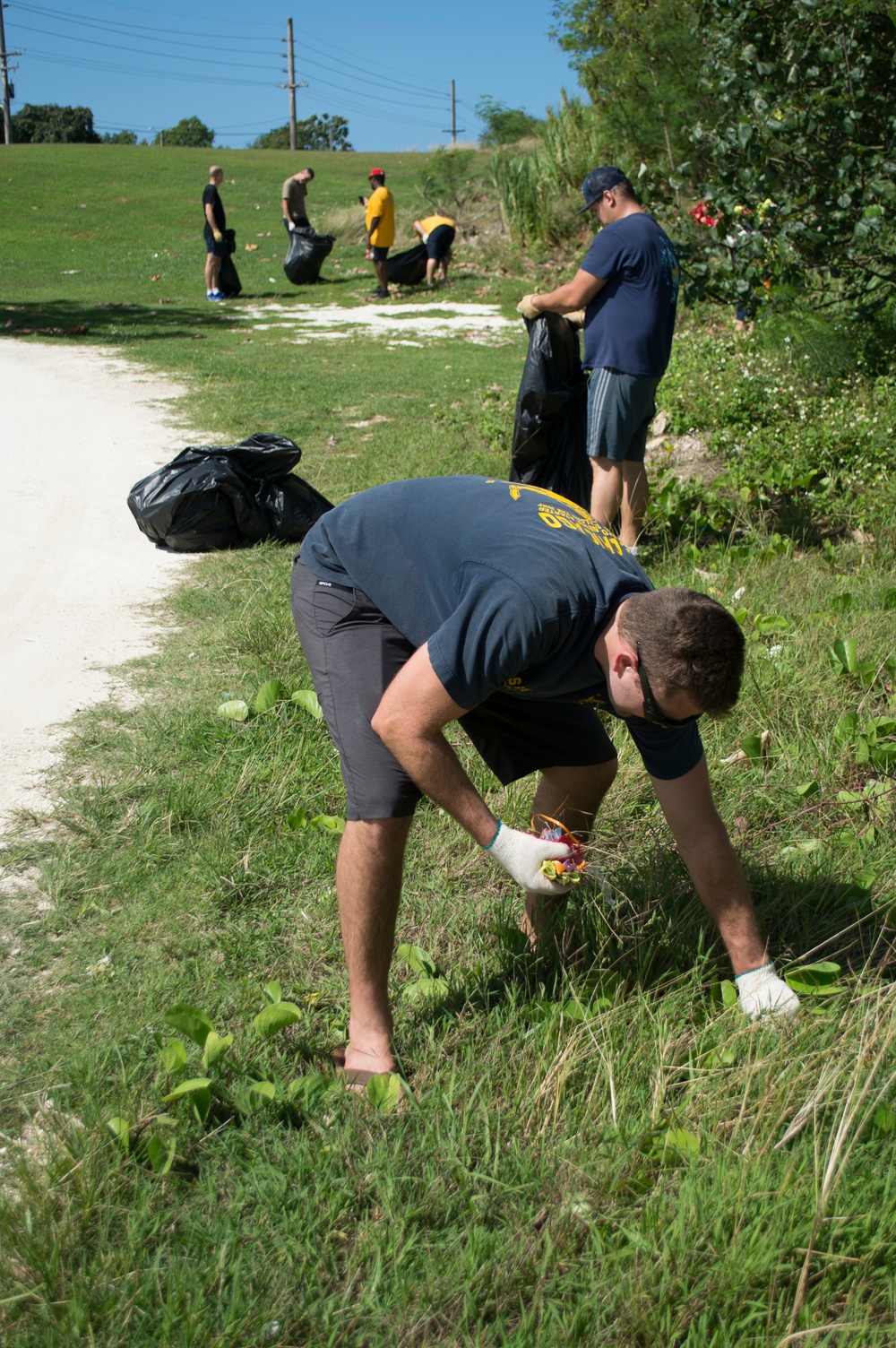 Guam Sailors, Families Clean Up Agat Cemetery for Earth Day 2018