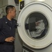 Ship's Serviceman does crew laundry
