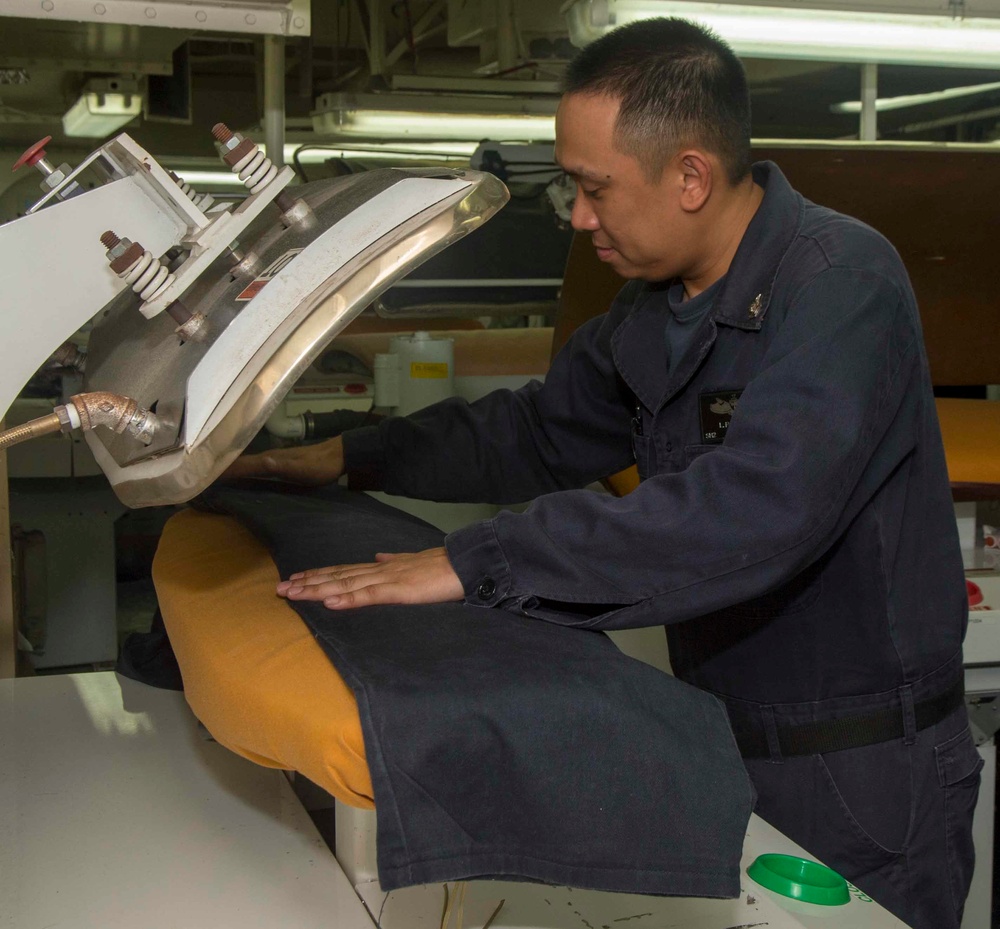 Ship's Serviceman does crew laundry