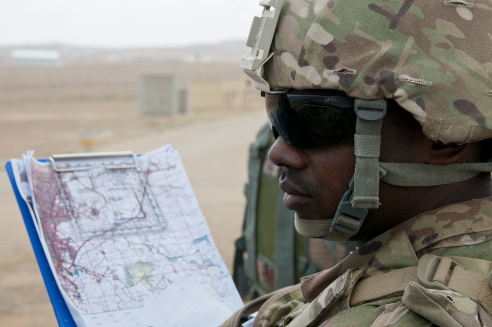 U.S. Soldier reviews map data with Jordanian counterparts
