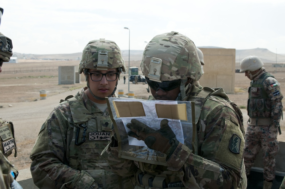 U.S. Soldiers review map data during training with Jordanian counterparts