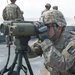 U.S. Soldier looks through laser designator during joint training