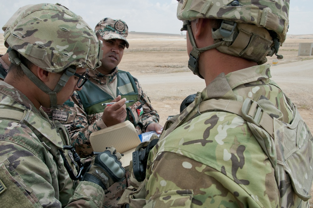 Jordanian, U.S. soldiers review firing data for simulated mortar mission