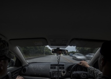 Handcuffs for Wrenches, 18 SFS and 18 AMXS Airmen switch jobs for a day