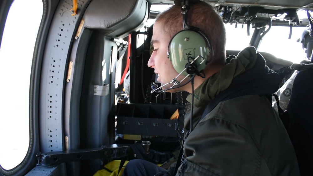 Seth Cummings flies aboard a Black Hawk helicopter.