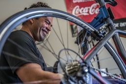 Pains, gains, and bike chains: U.S. Marine Corps wounded warrior gives back to injured brothers and sisters-in-arms